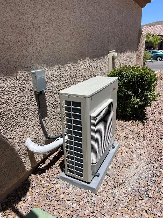 Residential air conditioning condenser unit in Verdigris